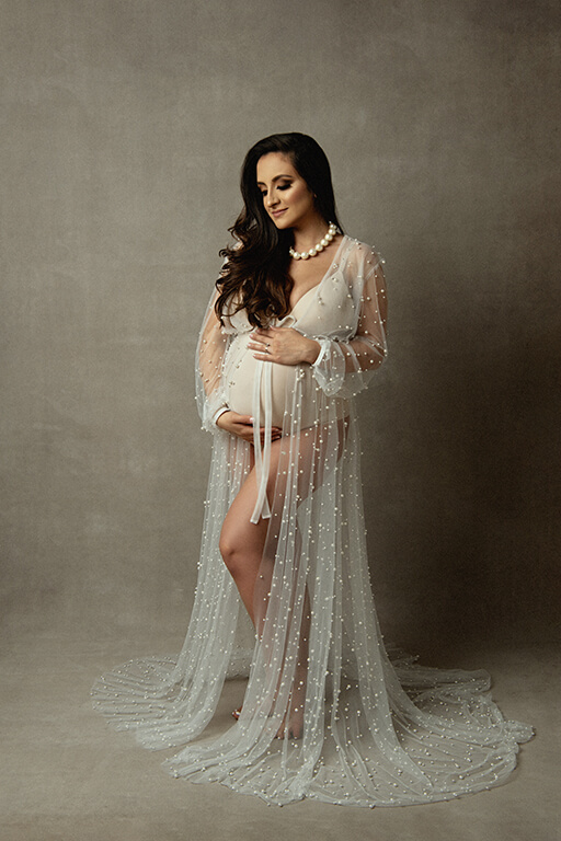 Baby bump photoshoot in studio with a pearls gown