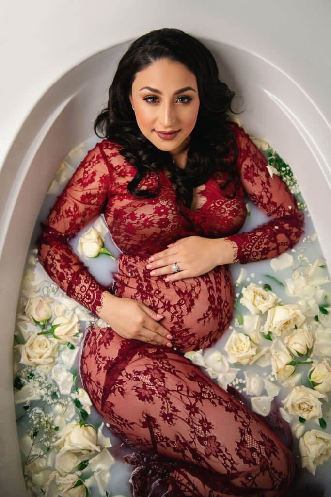 Fine art in studio maternity photography session milk bath