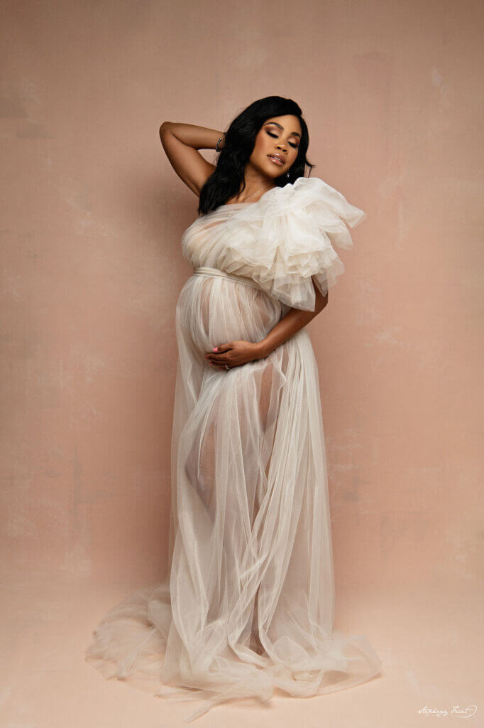 beautiful mamma to be posing in our maternity gown