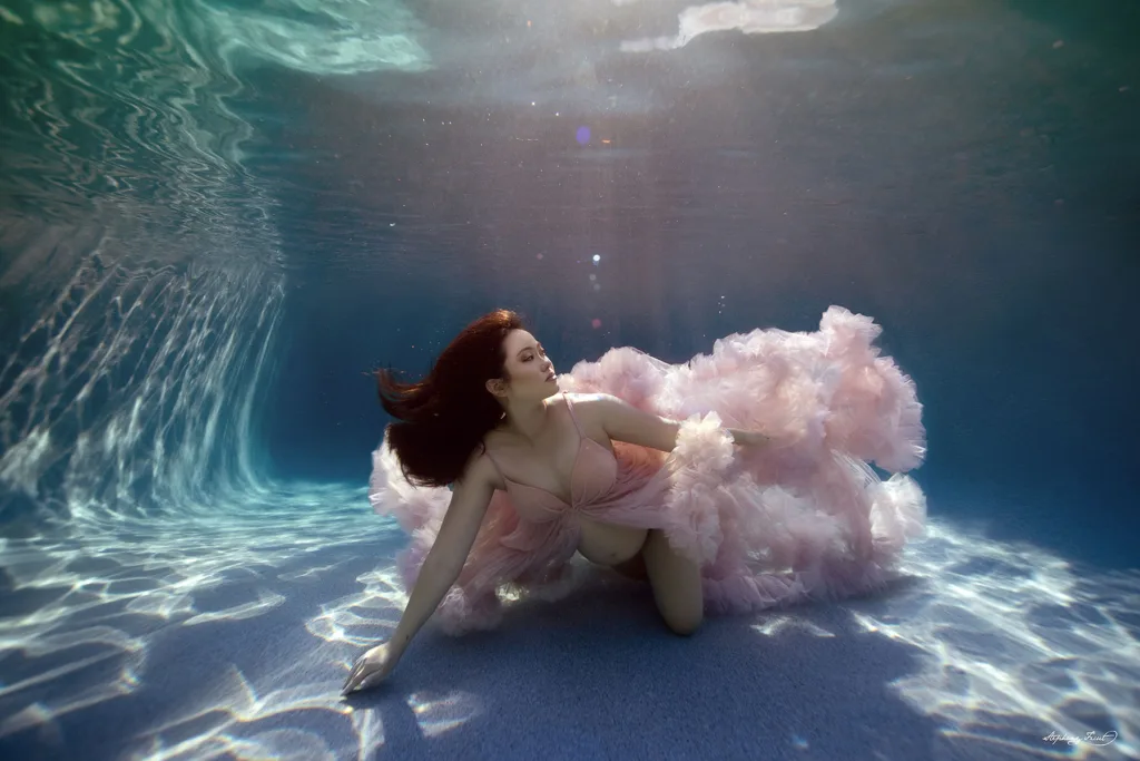 Underwater maternity maternity photo shoot in Dallas, Texas  by Stephany Ficut Photography with pink gown