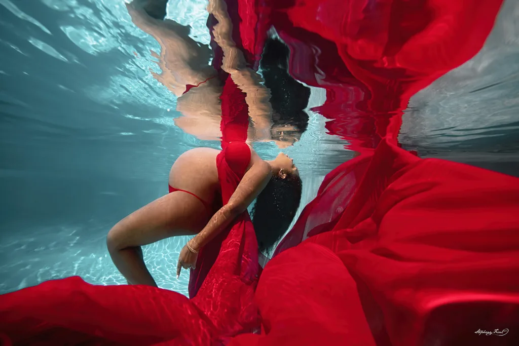 Underwater maternity maternity photo shoot in Dallas, Texas  by Stephany Ficut Photography with red gown